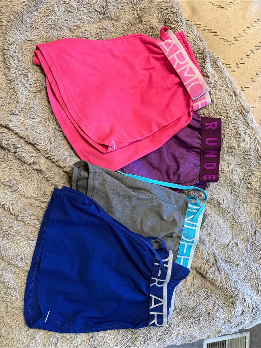 Under Armour Women's Multi-Pack Active Shorts in Pink, Purple, Gray, and Blue